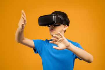 man in blue crew neck t shirt wearing black vr goggles
